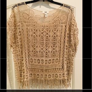 Crocheted beige overlay with fringe